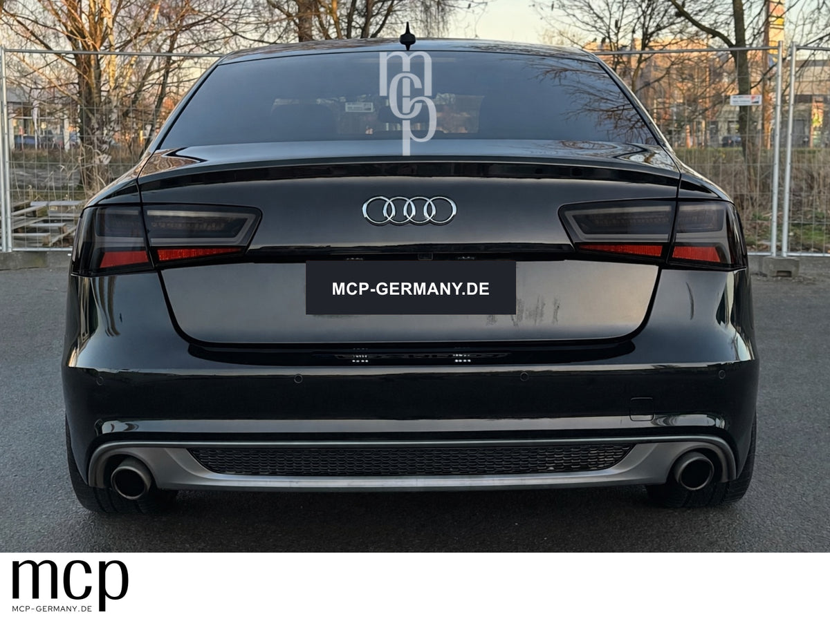 MCP 023163 – Audi A6 C7 Limousine Smoke – Bisheriges erstes Motiv: Einbauansicht am schwarzen Audi