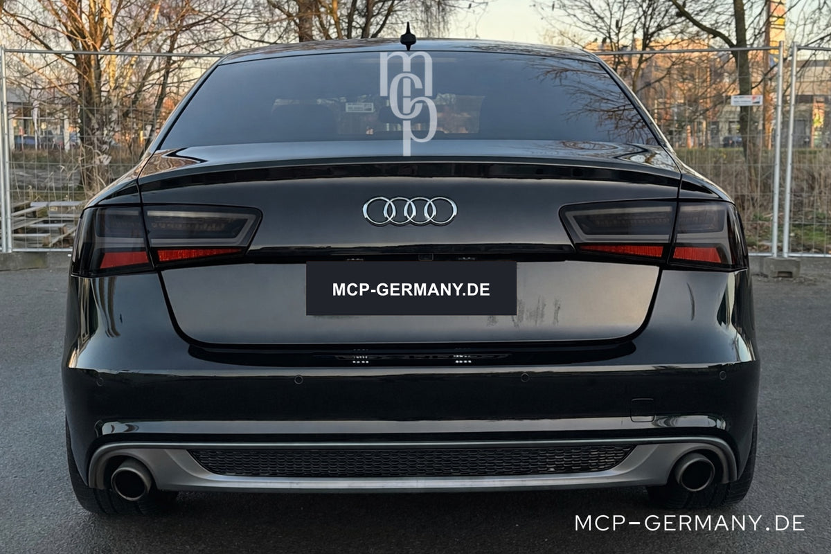 MCP 023163 – Audi A6 C7 Limousine Smoke – Bisheriges erstes Motiv: Einbauansicht am schwarzen Audi