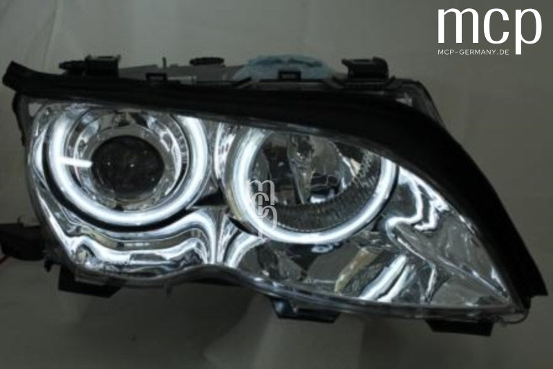 MCP 031027 – echte Einzelansicht eines CCFL Angel Eyes Scheinwerfers in Chrom für BMW E46 Limousine und Touring Facelift; CCFL-Ringe eingeschaltet.